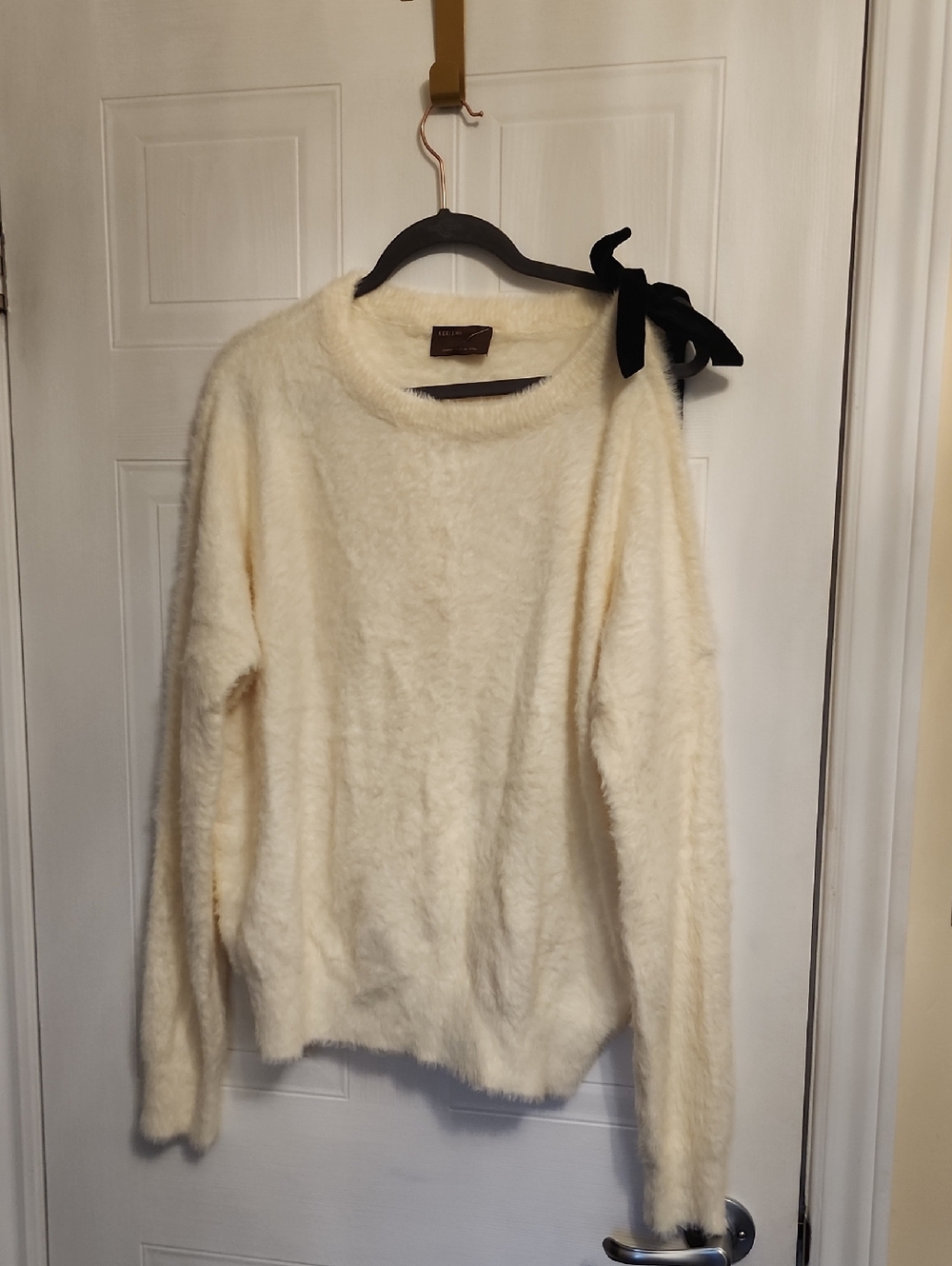 Kerisma Ivory Fuzzy Crewneck Sweater with Black Bow